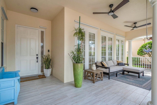 exterior space featuring an outdoor living space and ceiling fan