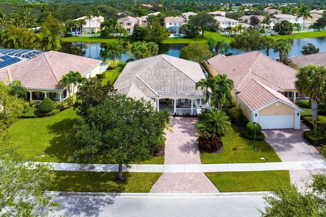 birds eye view of property featuring a residential view and a water view