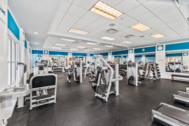 workout area featuring a paneled ceiling