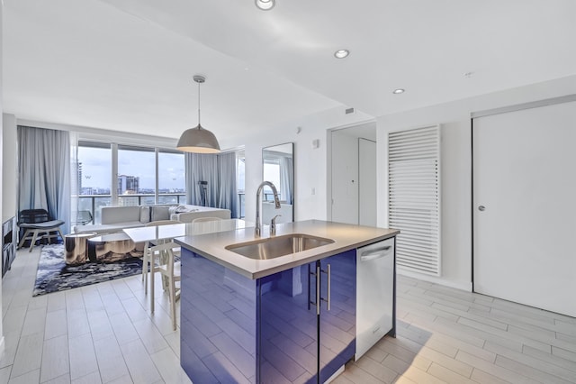 kitchen featuring decorative light fixtures, recessed lighting, a sink, dishwasher, and modern cabinets