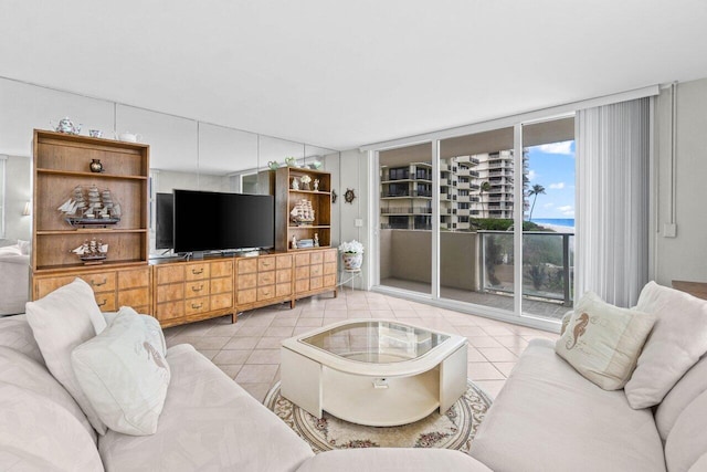 living area with light tile patterned floors and floor to ceiling windows