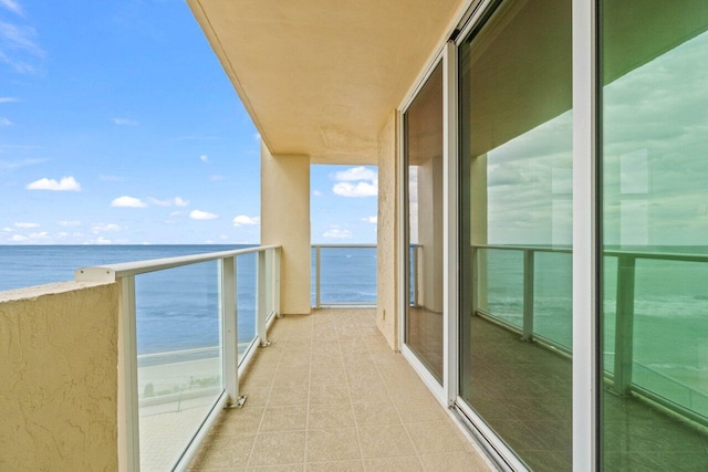 balcony featuring a water view