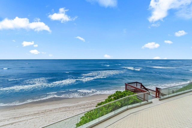 view of water feature with a beach view