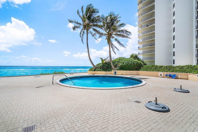 community pool with a water view