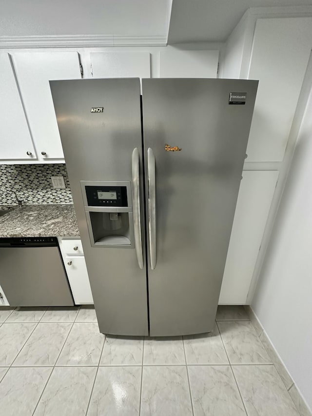 3850 Washington St Unit 510, Hollywood, FL 33021 - kitchen featuring stainless steel appliances, tasteful backsplash, white cabinets, and marble finish floor