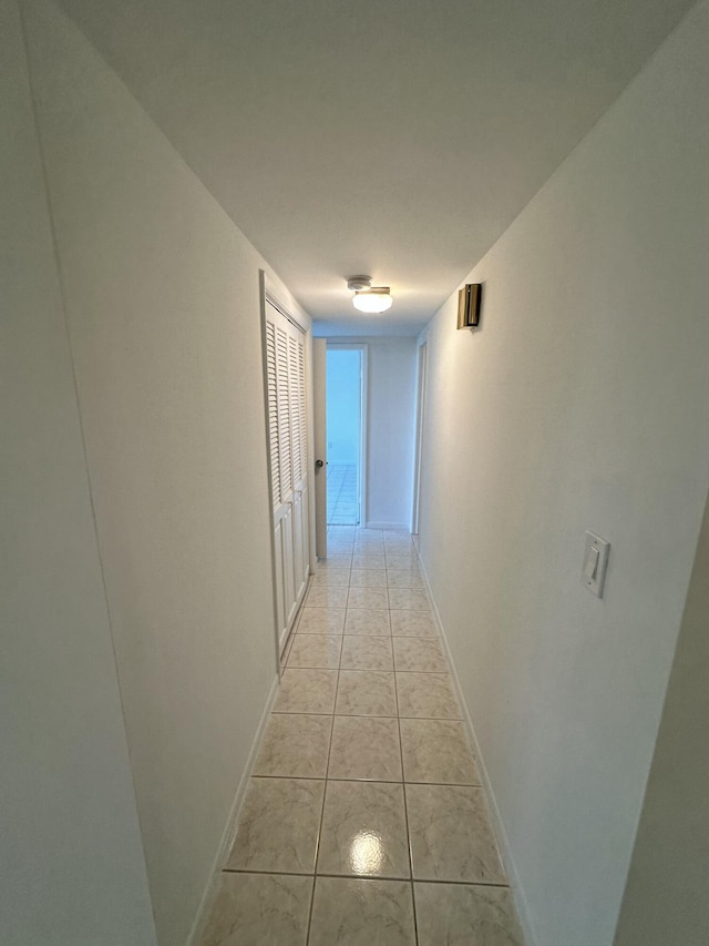 3850 Washington St Unit 510, Hollywood, FL 33021 - corridor with baseboards and light tile patterned flooring