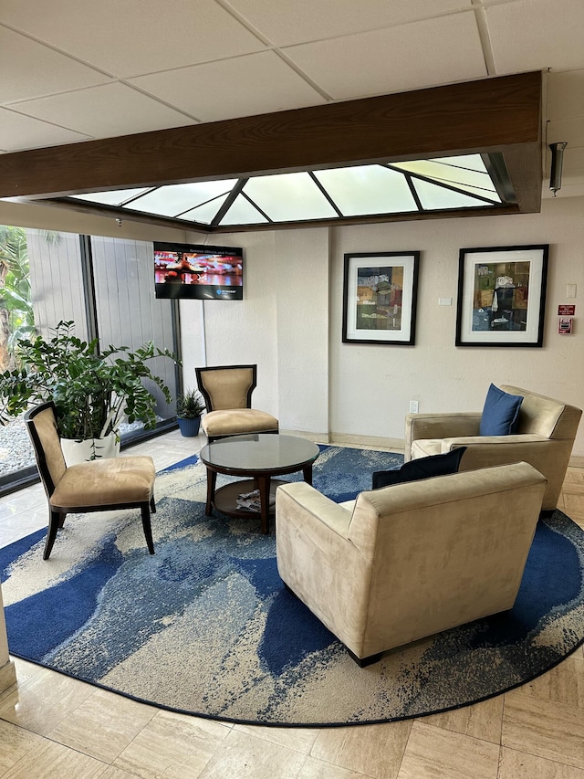 3850 Washington St Unit 510, Hollywood, FL 33021 - living room featuring a paneled ceiling and beamed ceiling