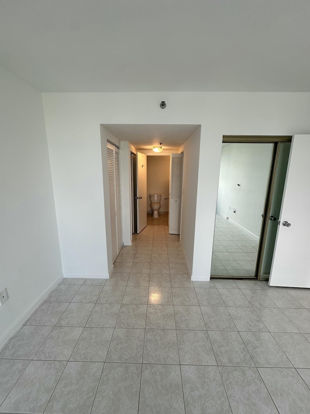 3850 Washington St Unit 510, Hollywood, FL 33021 - spare room featuring baseboards and light tile patterned flooring