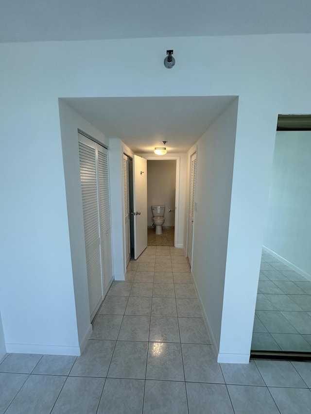 3850 Washington St Unit 510, Hollywood, FL 33021 - corridor with light tile patterned floors and baseboards