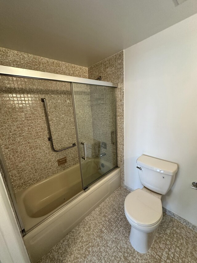 3850 Washington St Unit 510, Hollywood, FL 33021 - bathroom with toilet and combined bath / shower with glass door