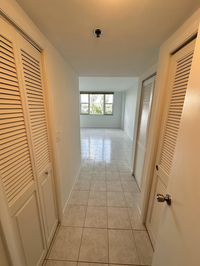 3850 Washington St Unit 510, Hollywood, FL 33021 - corridor featuring light tile patterned floors and baseboards