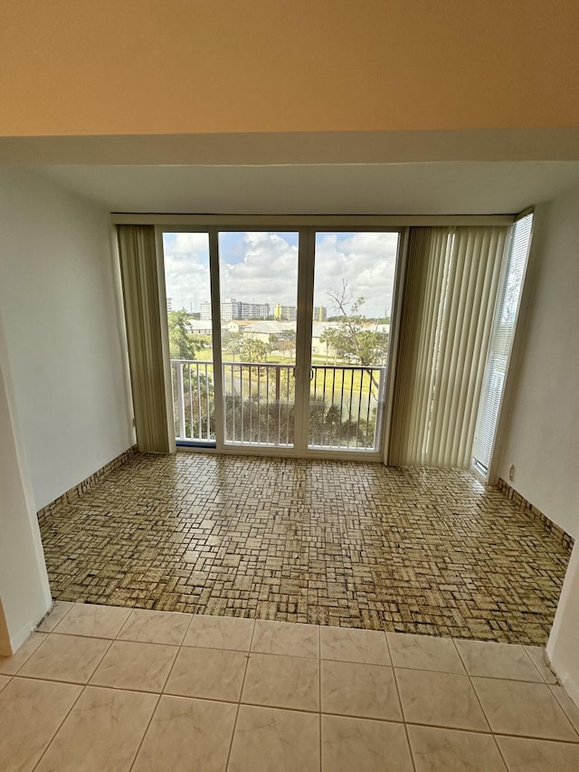 3850 Washington St Unit 510, Hollywood, FL 33021 - spare room featuring tile patterned floors and a view of city