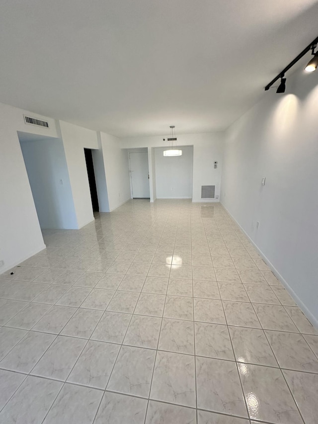 3850 Washington St Unit 510, Hollywood, FL 33021 - unfurnished living room featuring light tile patterned floors, visible vents, and track lighting