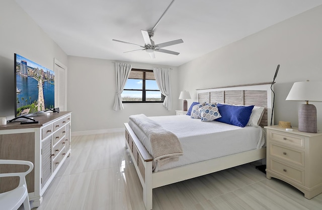 bedroom with baseboards and ceiling fan