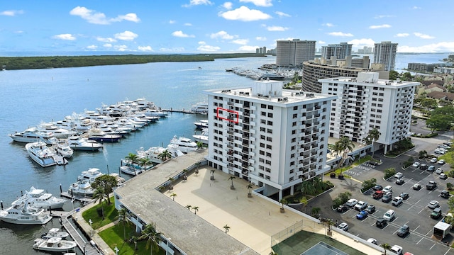 birds eye view of property featuring a view of city and a water view