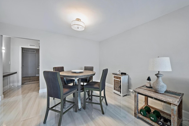 dining area with visible vents and baseboards