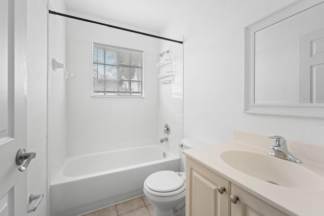 bathroom featuring tile patterned flooring, vanity, toilet, and bathing tub / shower combination