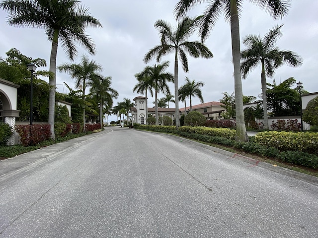 view of road featuring curbs and street lighting