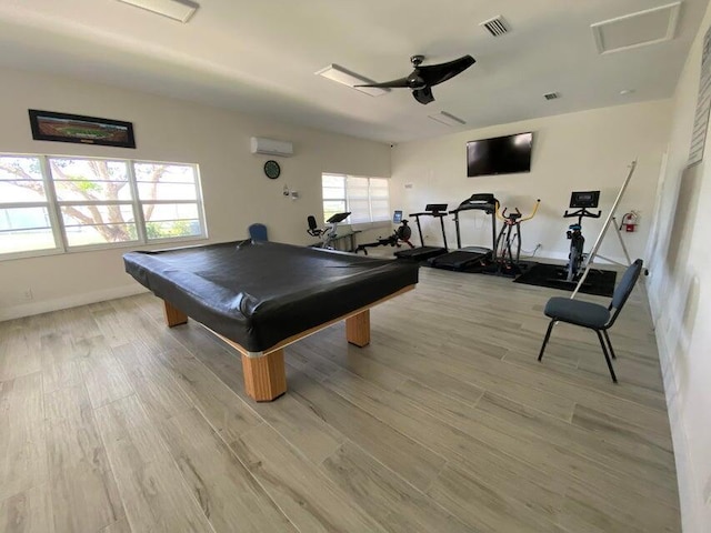 playroom with visible vents, pool table, ceiling fan, an AC wall unit, and light wood-style floors