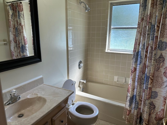 full bath with toilet, vanity, and shower / bath combo