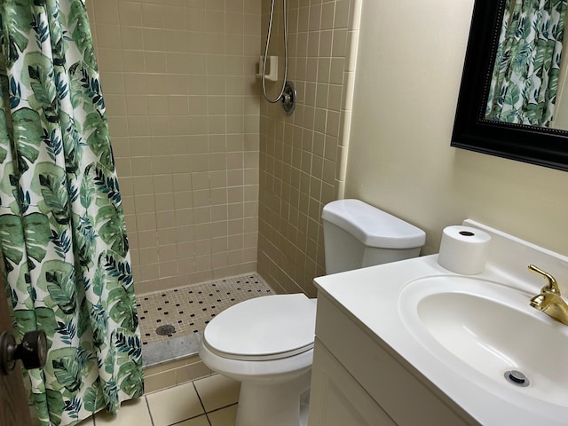 full bathroom with tile patterned floors, a stall shower, toilet, and vanity