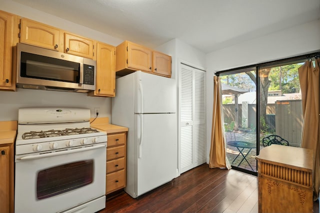 kitchen featuring white appliances, dark wood-style floors, light brown cabinets, and light countertops