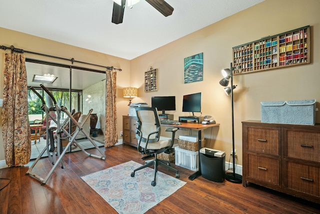 office area with baseboards, a ceiling fan, and hardwood / wood-style flooring