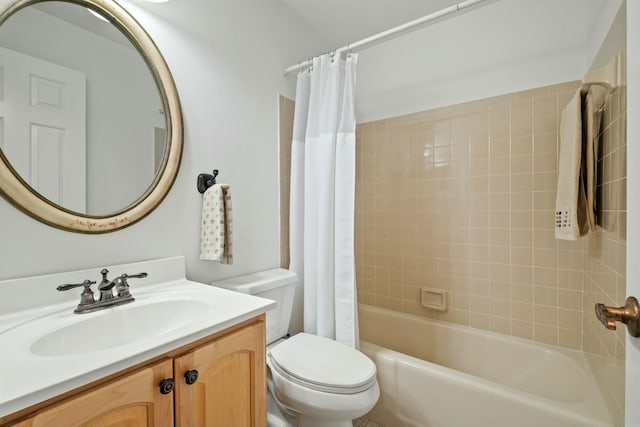 bathroom with vanity, toilet, and shower / tub combo with curtain