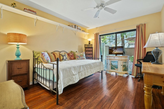 bedroom with access to exterior, ceiling fan, and wood finished floors