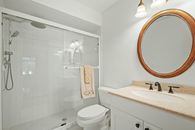 full bath with toilet, a shower stall, and vanity