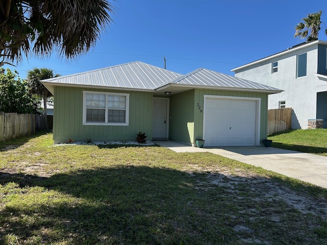 ranch-style house featuring a front lawn, concrete driveway, an attached garage, and fence