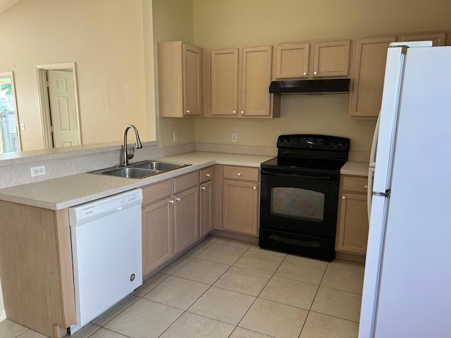 kitchen featuring under cabinet range hood, white appliances, light tile patterned flooring, and a sink