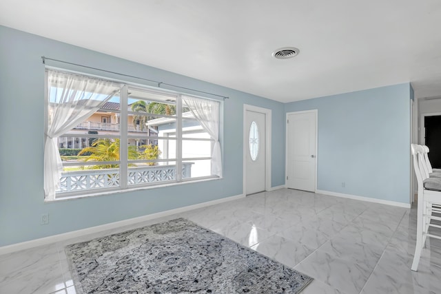 115 Elwa Pl, West Palm Beach, FL 33405 - entryway featuring marble finish flooring and baseboards