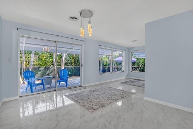115 Elwa Pl, West Palm Beach, FL 33405 - spare room featuring baseboards and marble finish floors