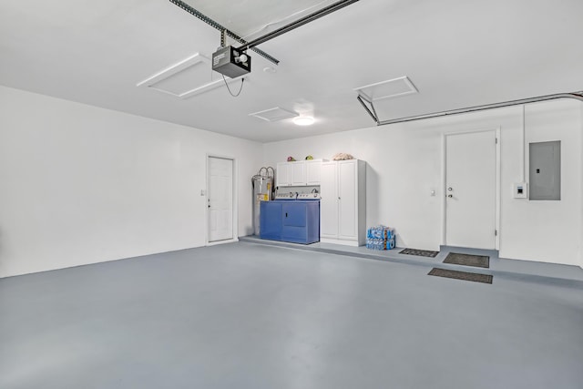 115 Elwa Pl, West Palm Beach, FL 33405 - garage with electric panel, water heater, and a garage door opener