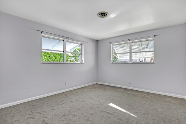 115 Elwa Pl, West Palm Beach, FL 33405 - carpeted spare room with plenty of natural light and baseboards