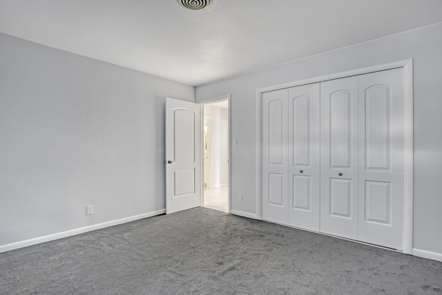 115 Elwa Pl, West Palm Beach, FL 33405 - unfurnished bedroom featuring carpet floors, baseboards, and a closet