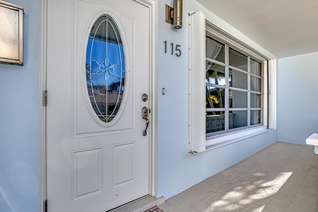 115 Elwa Pl, West Palm Beach, FL 33405 - doorway to property featuring covered porch
