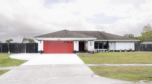 single story home with driveway, a front lawn, fence, an attached garage, and a shingled roof