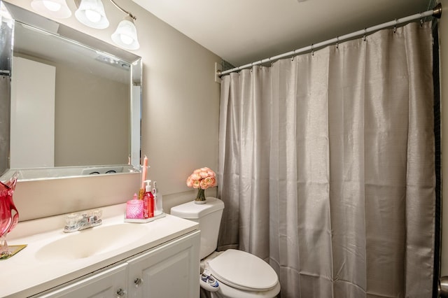 full bathroom featuring vanity and toilet