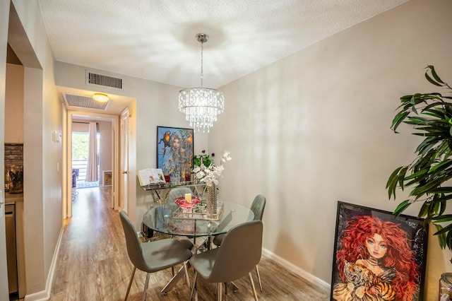 2012 Durham A, Deerfield Beach, FL 33442 - dining room with wood finished floors, baseboards, and a chandelier