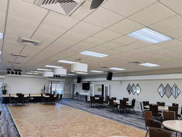 interior space with parquet flooring and visible vents