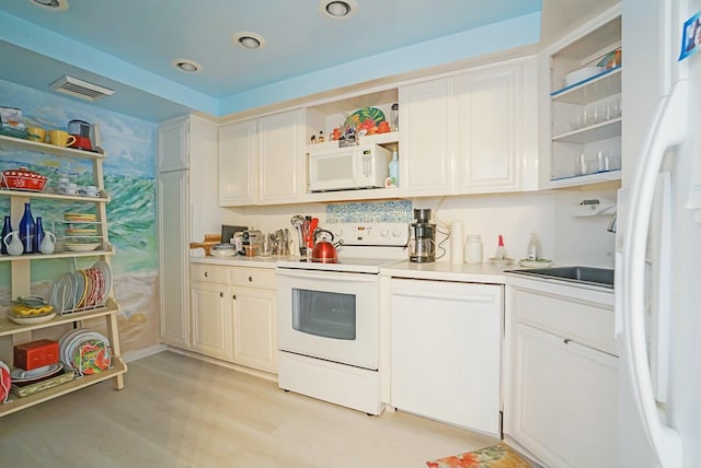 kitchen featuring white appliances, visible vents, open shelves, light countertops, and white cabinets