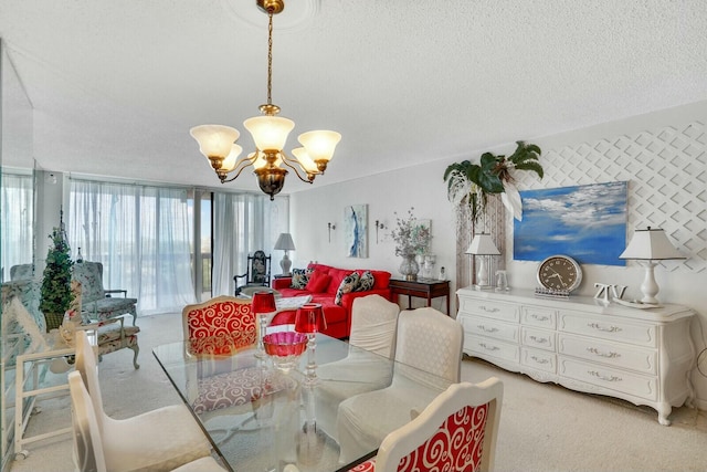 dining room featuring light carpet, a chandelier, and a textured ceiling