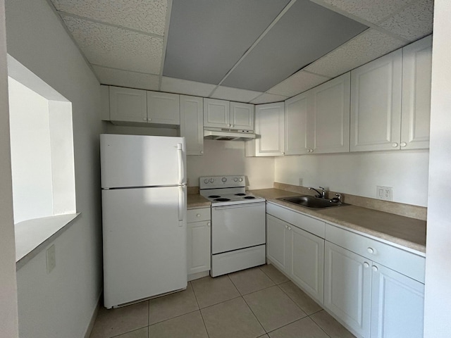 kitchen featuring under cabinet range hood, white appliances, white cabinetry, and a sink