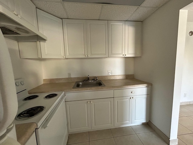 kitchen featuring a sink, white cabinetry, under cabinet range hood, and white range with electric stovetop