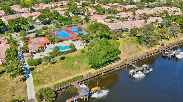 bird's eye view with a residential view and a water view