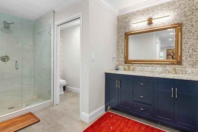 full bath with toilet, ornamental molding, a marble finish shower, and a sink