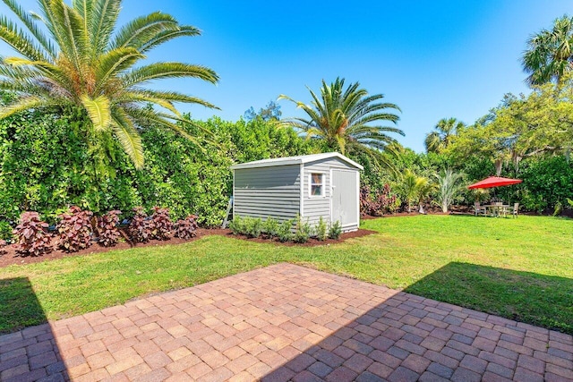 view of patio with a storage shed and an outdoor structure