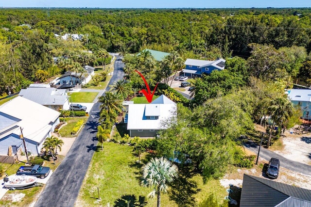 aerial view with a residential view and a view of trees